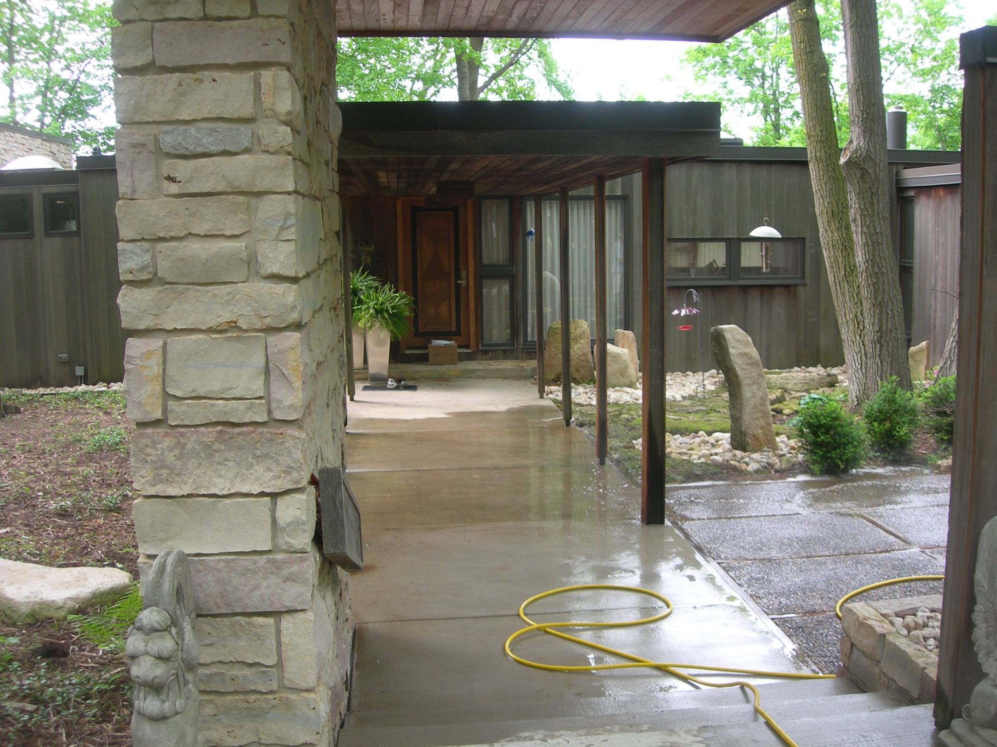 Power Washing a House